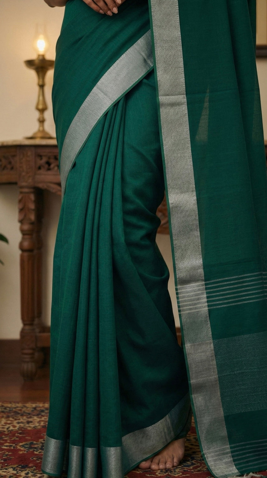 Rama green linen cotton saree with silver zari border